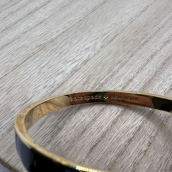 Kate Spade New York Black Enamel and Gold Tone Wave Twist Bangle Bracelet - Picture 3 of 11